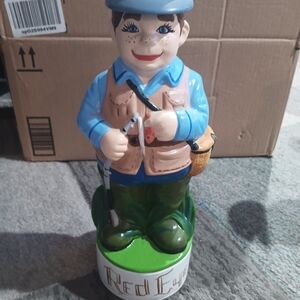 Charming Ceramic Fisherman Figurine with Blue and Green Outfit